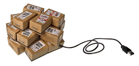 Online shopping shown by Brown shipping boxes with a USB Cable