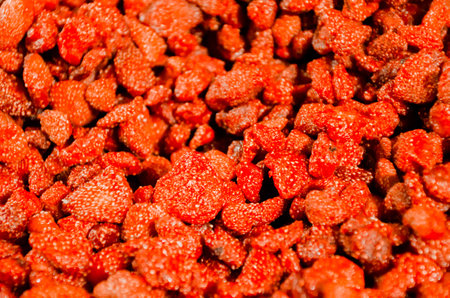 Dried strawberries closeup background texture