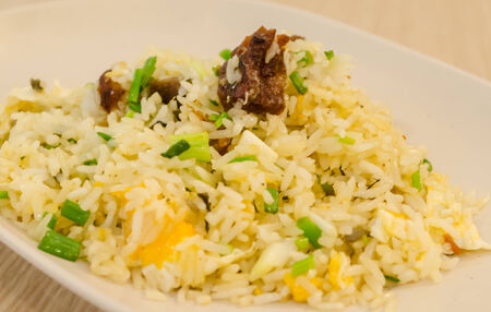 Chinese traditional Fried Rice with Crispy Pork and Oliveの写真素材