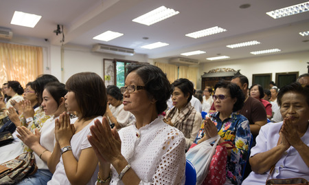 Bangkok , Thailand - September 21, 2014:  Unidentified Thai Buddhist people sit around indoor  for listen to Dhamma of Buddhism from monks at Wat Rajadhivas Temple in Dusit Area ,  Bangkok Thailandのeditorial素材