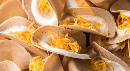 Thai sweet flavour crispy fancy  pancake closeup in marketの写真素材