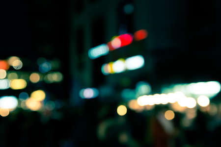 Blur defocused of neon light in urban at night abstract backgroundの写真素材