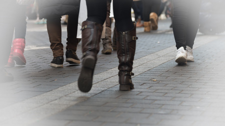 Walking people on the street  focus on shoesの写真素材
