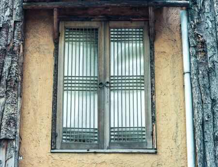 Old window in abandoned houseの写真素材