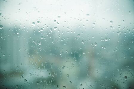 Mirror with rain drops in city abstract backgroundの写真素材