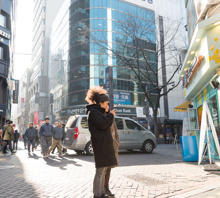 Seoul, Republic of Korea - December 31, 2014 : Unidentified people use mobile device around city in Seoul,South Koreaのeditorial素材