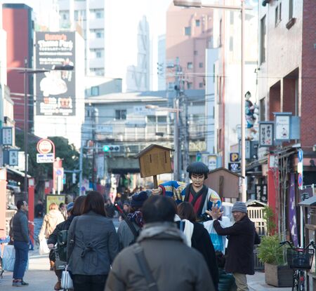 Tokyo , Japan  - February 3, 2015 : Landmark in district of Asakusa area with people walk around with Ichikawa Goemon, famous thief in Japan history located in front of Sensoji Temple in Tokyo, Japanのeditorial素材