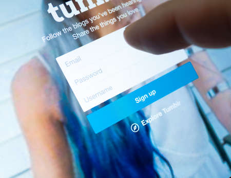 Bangkok, Thailand - June 17, 2015  : Tumblr page with finger touch on sign up page with Email ,Password and Username textbox. Tumblr is one of the famous social network website media sharing in the worldのeditorial素材