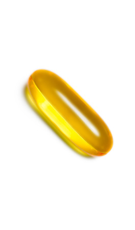 Fish oil pill isolated  on white background verticalの写真素材
