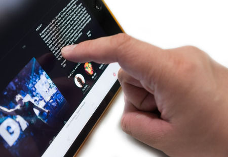 Bangkok, Thailand - July 2, 2015 :Unknown man  touches on screen to use 'Apple Music' Application isolated , new music streaming product  from Apple Inc.Iのeditorial素材