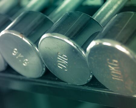 Rustic dumbell closeup on 9 kg one pastel tone の写真素材