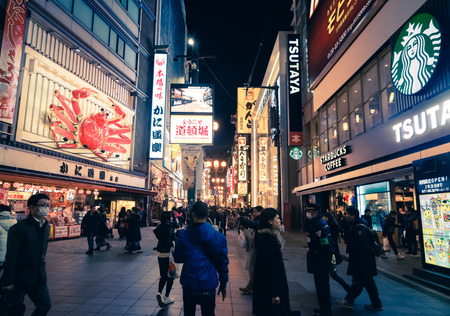 Osaka, Japan - February 2 , 2015 : Urban scene with retail service around Giant Crab restaurant area...