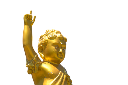 Golden baby Buddha statue raise arm and point forefinger up to blue sky pose isolated on white backgroundの写真素材