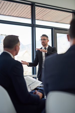 Ironing out the details. Shot of corporate businesspeople meeting in the boardroom.の写真素材