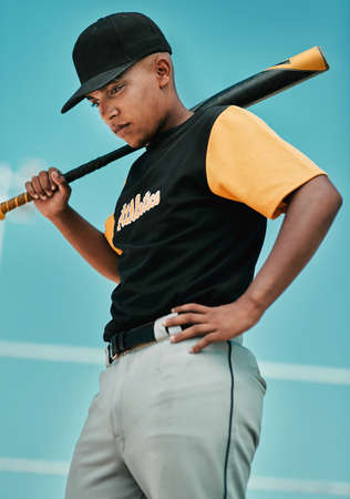 Ill have better luck next time. Shot of a young baseball player holding a baseball bat while posing outside on the pitch.の写真素材