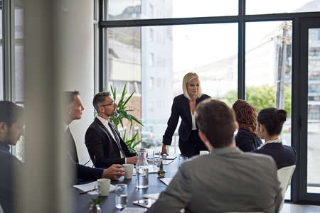 Ironing out the details. Shot of corporate businesspeople meeting in the boardroom.の写真素材