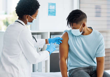 This vaccine will kick in soon. Shot of a doctor giving her patient an injection.
