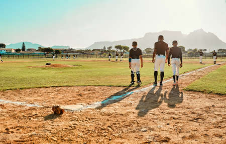 They gave it all they got. Rearview shot of baseball player walking on the pitch during a game.の写真素材
