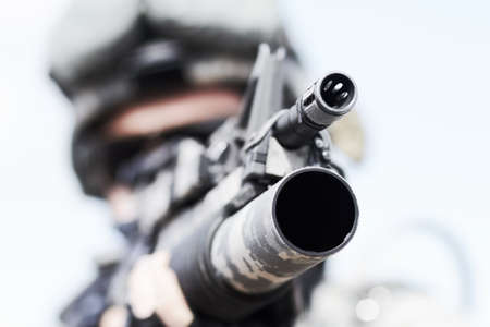 War weaponry. Closeup selective focus of the barrel of a gun.の写真素材