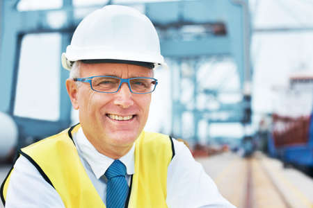 Safety first. Portrait of a dock worker standing at the harbor amidst shipping industry activity.