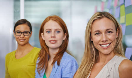 Not just pretty faces. Three attractive female colleagues ready for the working day.の写真素材