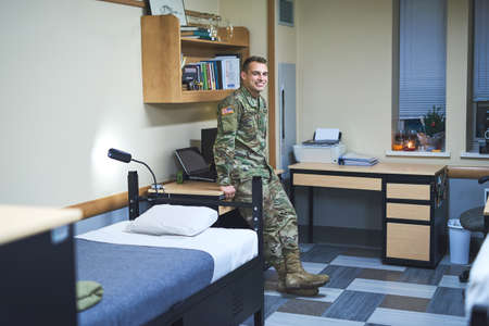 Daily life in the military dorms. Shot of a young soldier in the dorms of a military academy.の写真素材