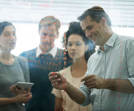 Real life businesspeople shot on location. Since these locations are the real thing, and not shot in an "office studio", high ISO levels are sometimes needed to catch the moment. The ISO range is between 250-600 so it should be fine for most usage cases. Most people won't notice anything really, but if you are a nerd like us, you can see a little noise.の写真素材