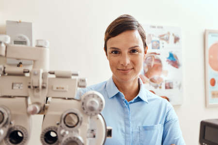 Im keeping my eyes on yours. Portrait of a confident woman using an optical refractor in an...