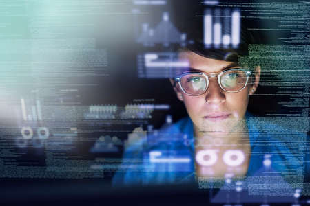 Shes the best programmer around. Cropped shot of a young computer programmer looking through data.