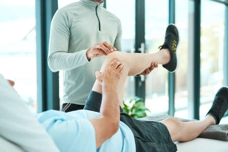 Can you feel this. Shot of a senior man consulting with his physiotherapist.
