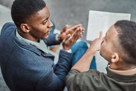 Constructing the perfect recipe for success. Shot of two young businessmen having an informal...