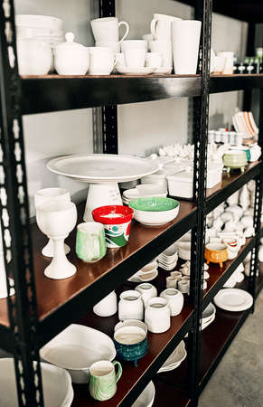 Come help yourself to sale items. Cropped shot of a potters ceramic collection neatly arranged on a...
