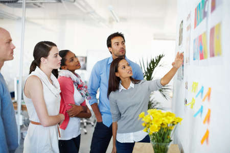 Theres no better work than teamwork. Shot of a group of casually dressed businesspeople in the...