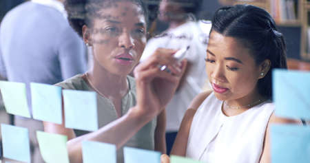 It takes a team to keep content fresh. 4k video footage of a young businesswoman having a...