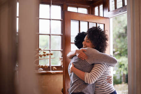 Youre back. Cropped shot of a young woman greeting her husband at the door.