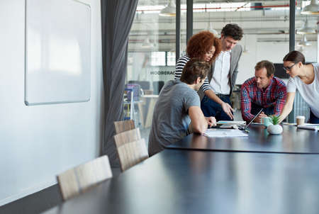 Getting into the nitty gritty. Shot of office workers in a meeting in a boardroom.