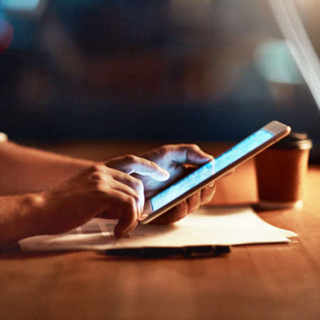 Find the tool thatll make you an overnight success. Cropped shot of an unrecognizable person using a...