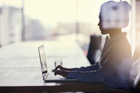 Big dreams require hard work. Cropped shot of a businesswoman working on her laptop in the office.