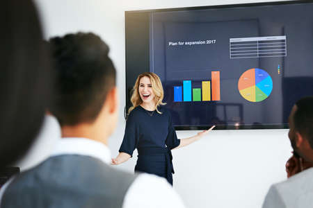 Weve seen massive growth. Shot of a businesswoman giving a presentation to her colleagues at work.
