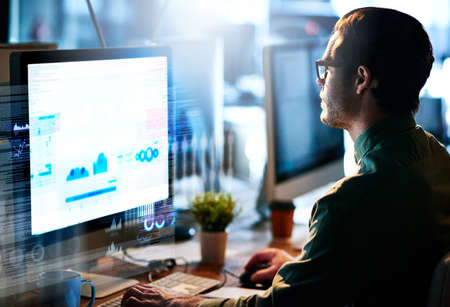 Hes developing new code. Cropped shot of a male computer programmer working on new code.