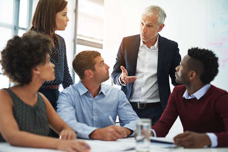 They rely on their ability to function as a team. Cropped shot of corporate businesspeople in the...
