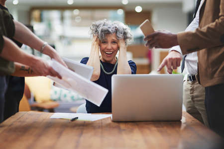 I cant take anymore. Portrait of a mature businesswoman looking stressed in a demanding office environment.の写真素材