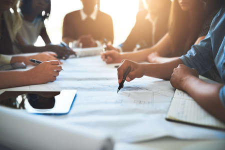 Making collaboration work. Cropped shot of a group of architects working together on a project.