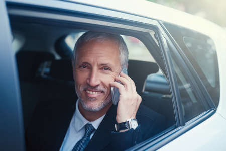 Technology fit for the man on the move. Shot of a businessman answering his cellphone while sitting...