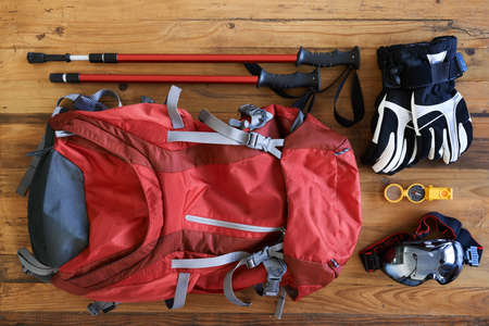 Hiking paraphernalia. Shot of various tools and equipment for a hiker laid out on a table.