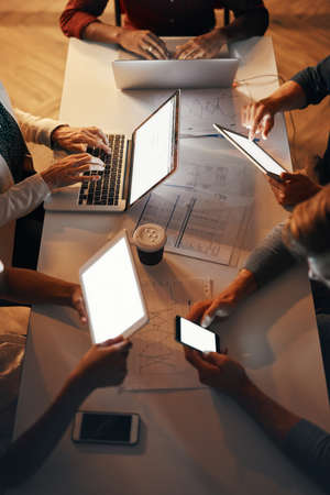 Different types of technology can help your business maximize efficiency. High angle shot of a group...