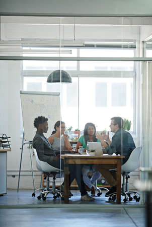 Building ideas. Shot of a group of coworkers in a boardroom meeting.