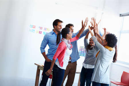 Theres no better work than teamwork. Shot of a group of casually dressed businesspeople in the...