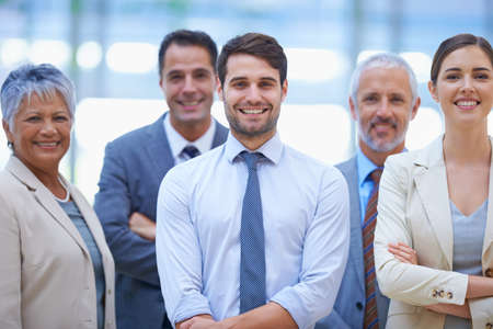 Faces you can trust. A cropped portrait of a group of happy businesspeople.