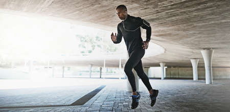 The city is my gym. Shot of a young person working out in and around the city.の写真素材